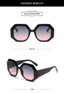 Detail view of octagon sunglasses with black frames and gray pink gradient lenses