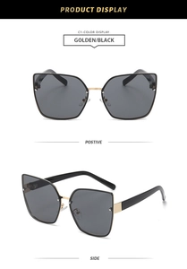 Detail view of retro rimless cat eye sunglasses with gold metal bridge and black lenses