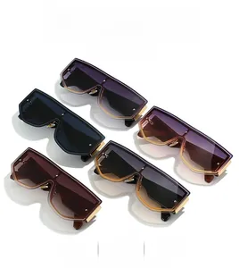 Detail view showing five colorful oversized flat-top sunglasses with silver rivet accents