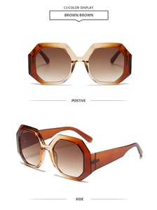 Detail of brown geometric oversized sunglasses with gradient lenses and thick frames