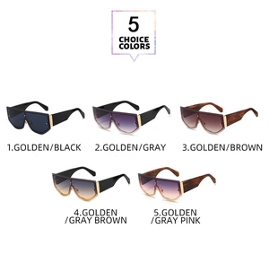 Five oversized shield sunglasses with gold metal trim in assorted gradient lens colors