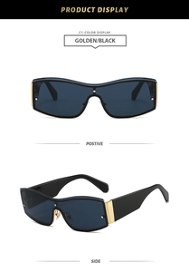 Detail of rimless oversized sunglasses with golden metal frame and black temple tips