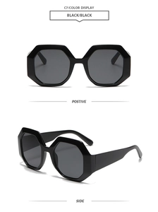 Front and side views of black hexagonal oversized sunglasses with geometric frames