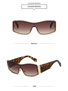 Close-up of golden brown rimless sunglasses with gradient lenses and metal rivet details