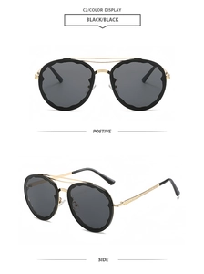 Detail view of double bridge sunglasses with scalloped inner rim and gold floral temples