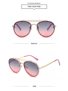 Detail view of pink-gray gradient lenses and wave-edge gold metal double-bridge sunglasses