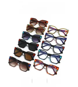 Top view of square sunglasses with colorful geometric block patterns on thick frames