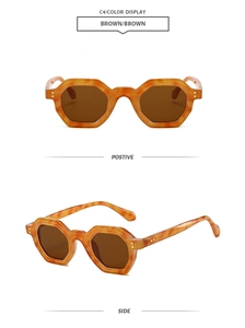 Detail view of hexagonal sunglasses with brown tortoiseshell frame and dark lenses