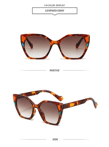 Detail view of leopard print square sunglasses with orange and blue color block accents
