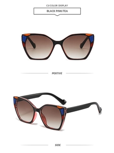 Detail view of square cat-eye sunglasses with unique pink and blue color-block frames