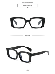 Detail view of retro rectangle thick black frames with anti-blue light clear lenses