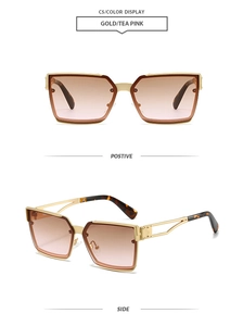 Detail view of gold metal square sunglasses with tea pink gradient lenses and hollow temples