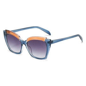 Cat eye sunglasses with translucent blue frame and orange trim at a 45-degree angle
