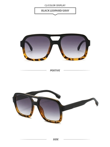 Macro detail of classic aviator sunglasses in black leopard frame with gray gradient lenses
