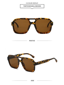 Close-up detail of tortoiseshell pilot sunglasses showing double bridge and brown lenses