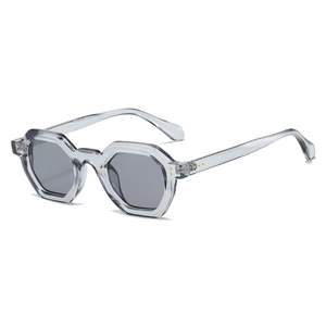Octagonal transparent grey sunglasses with dark grey lenses and golden rivets