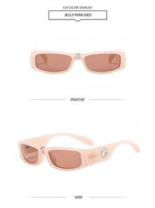 Detail of jelly pink rectangular sunglasses with red lenses and silver metal hinges