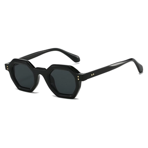 Modern retro polygonal sunglasses with dark grey lenses and golden rivet accents