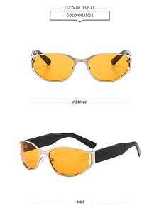 Vue détaillée de lunettes de soleil œil de chat rétro avec monture dorée et verres orange