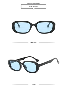 Detail view of black square frame sunglasses with light blue transparent lenses
