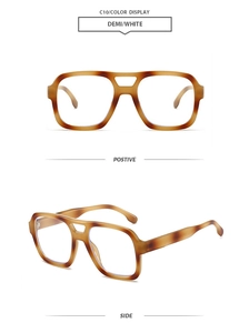 Detail view of tortoiseshell double-bridge pilot sunglasses with demi and white finish