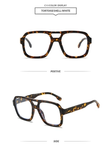 Detail view of tortoiseshell double-bridge aviator sunglasses with light blue lenses