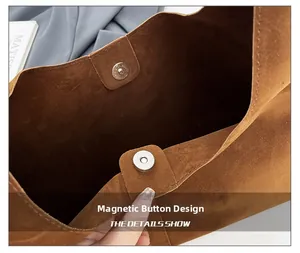 Detail of magnetic snap closure on vintage brown frosted leather tote shoulder bag