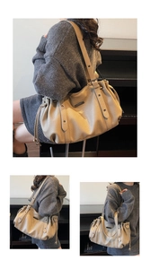Detail of beige lychee leather tote bag featuring drawstring closure and metal eyelets