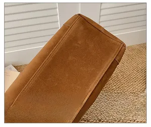 Detail shot of brown suede tote bag featuring reinforced stitching and premium matte texture