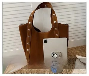 Detailed comparison of brown suede tote bag size with tablet for large capacity storage