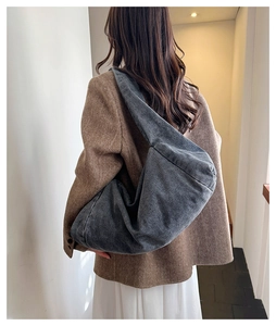 Dark grey washed denim large tote bag styled with a blazer for a chic casual look