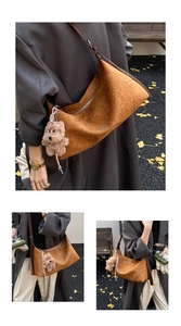 Close-up of ginger yellow tote bag with pleated texture and cute plush bear charm