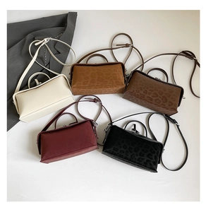 Top view of rectangular leopard print and solid shoulder bags in multiple colors