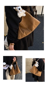 Brown suede hobo bag with contrast stitching and lovely plush bear charm detail