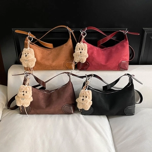 Minimalist dumpling handbags in four colors with cute plush bear charms and suede finish