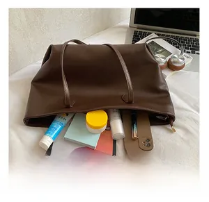 Detailed view of dark coffee tote bag interior showing large capacity for essentials