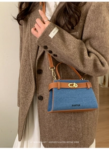 Detail of PANTOR denim and brown leather tote bag with gold metal twist lock buckle