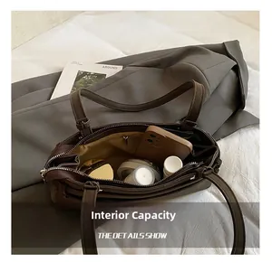 Detailed interior of brown matte Boston bag showing large capacity for essentials