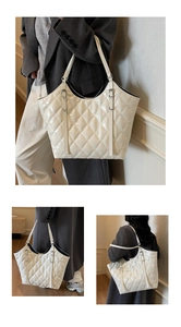Detail of cream tote bag featuring quilted diamond pattern and glossy patent leather finish