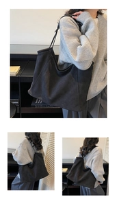 Close-up of black suede tote bag showing soft matte texture and minimalist shoulder strap