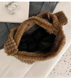 Detailed view of the brown plush tote bag showing inner magnetic closure and large capacity
