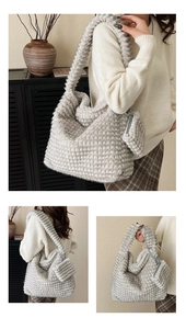 Detail view of plush textured hobo bag with matching mini pouch and wide shoulder strap