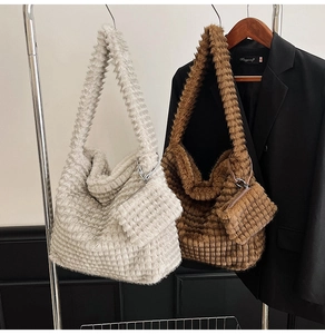 Detail of plush tote bag with checkered texture and matching small zipper coin purse