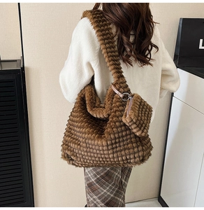 Detail of plush tote bag with checkered texture and matching mini zipper pouch