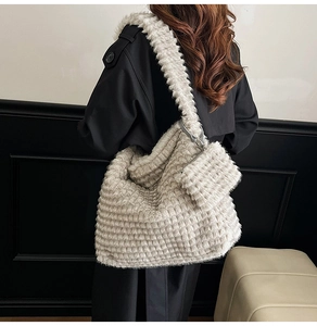 Detail showing plush beige faux fur tote bag with horizontal texture and matching pouch