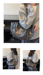 Close-up of large vintage tote bag featuring drawstring detail and long strap accent