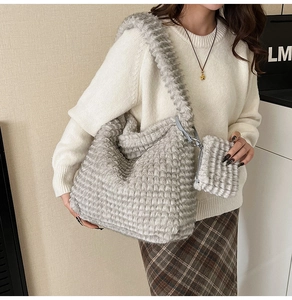 Close-up of grey plush tote bag set featuring vertical textured faux fur and small pouch