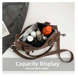 Top view of large brown Boston tote showing spacious interior with iPad and water bottle