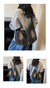 Detailed shot of studded washed denim hobo bag featuring vintage silver metal hardware