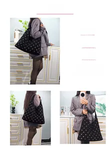 Three ways to wear the black suede tote bag with metallic eyelets: shoulder, hand, and arm carry